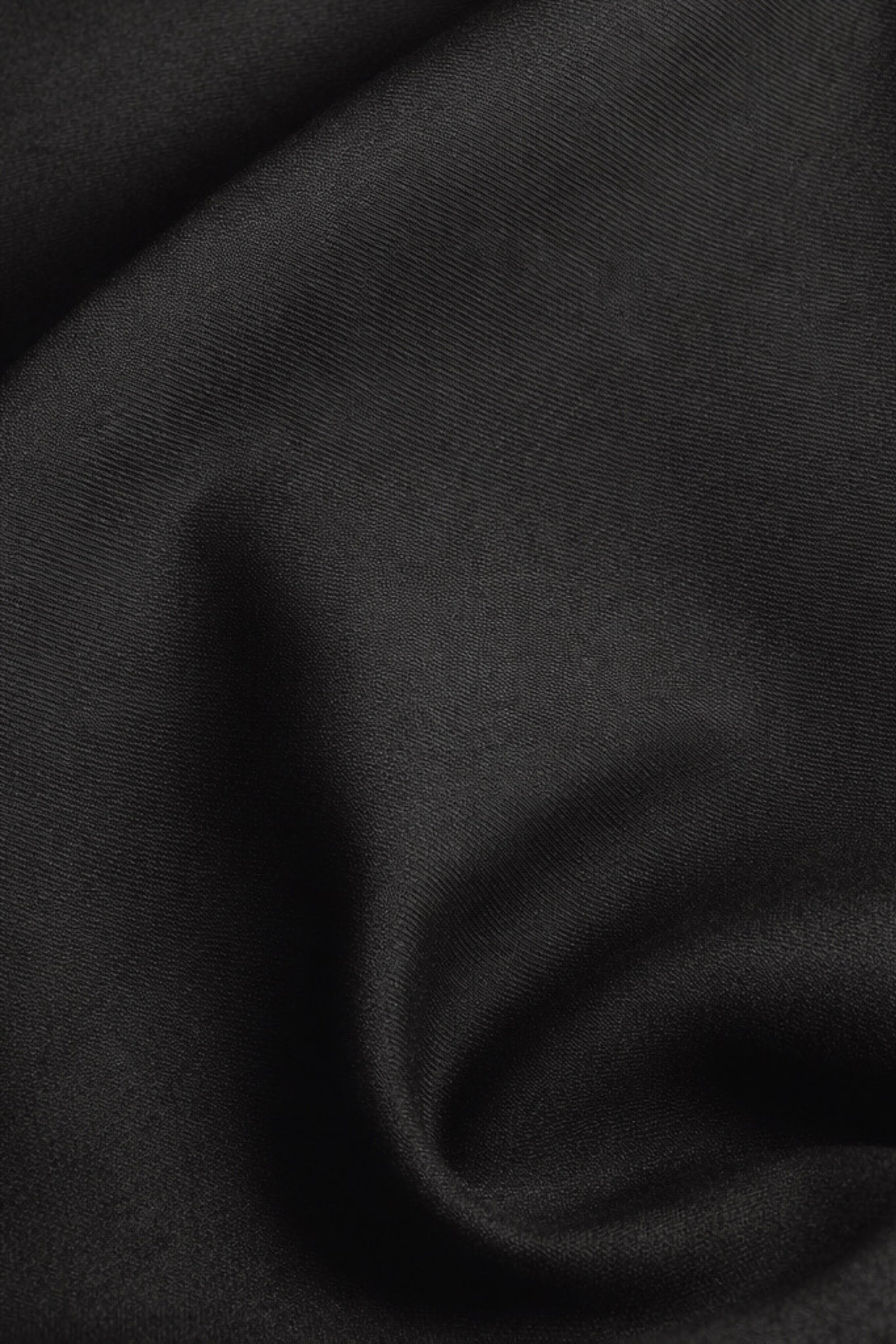 Emfique Sculptural Column Skirt detail — silver fiber protective fabric